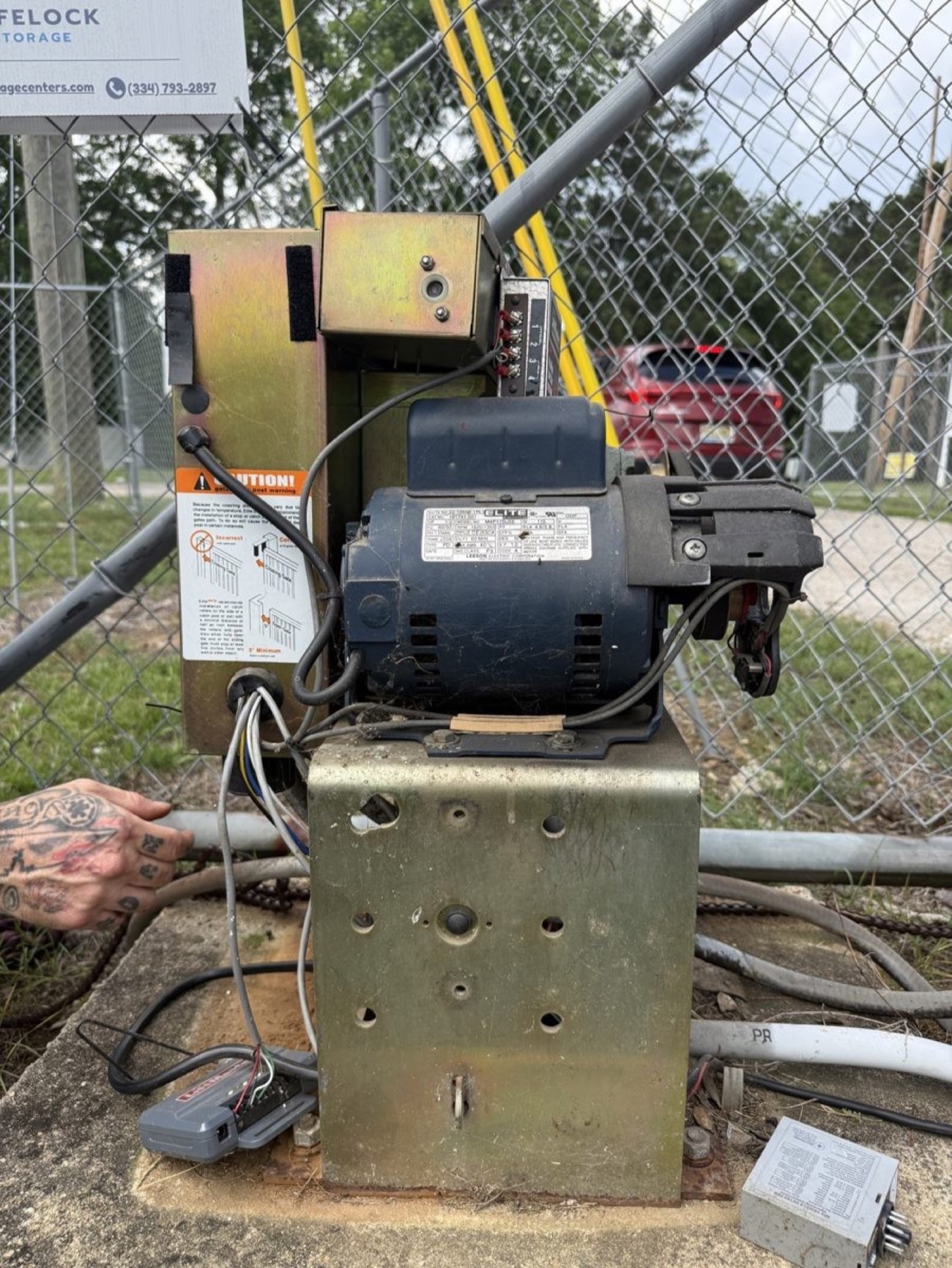 The property's second slide gate operator on its concrete pad