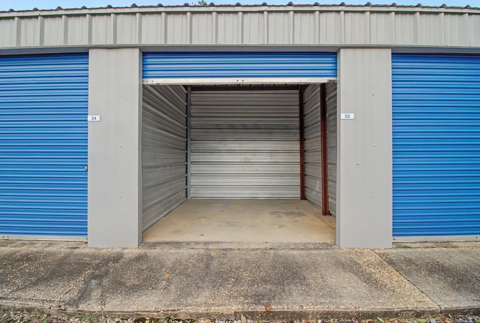Open, empty drive-up storage unit at Safelock Storage Dothan